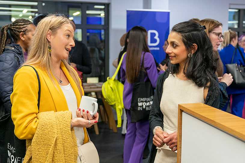 Women talking at small business networking event
