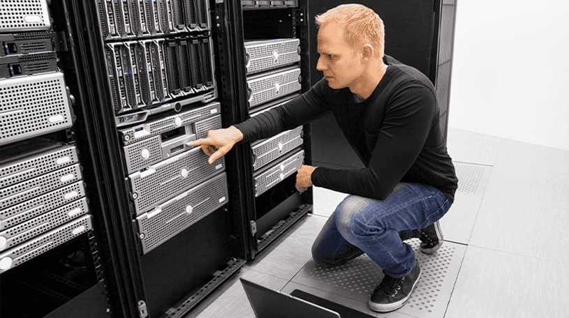 An IT technician checking a server
