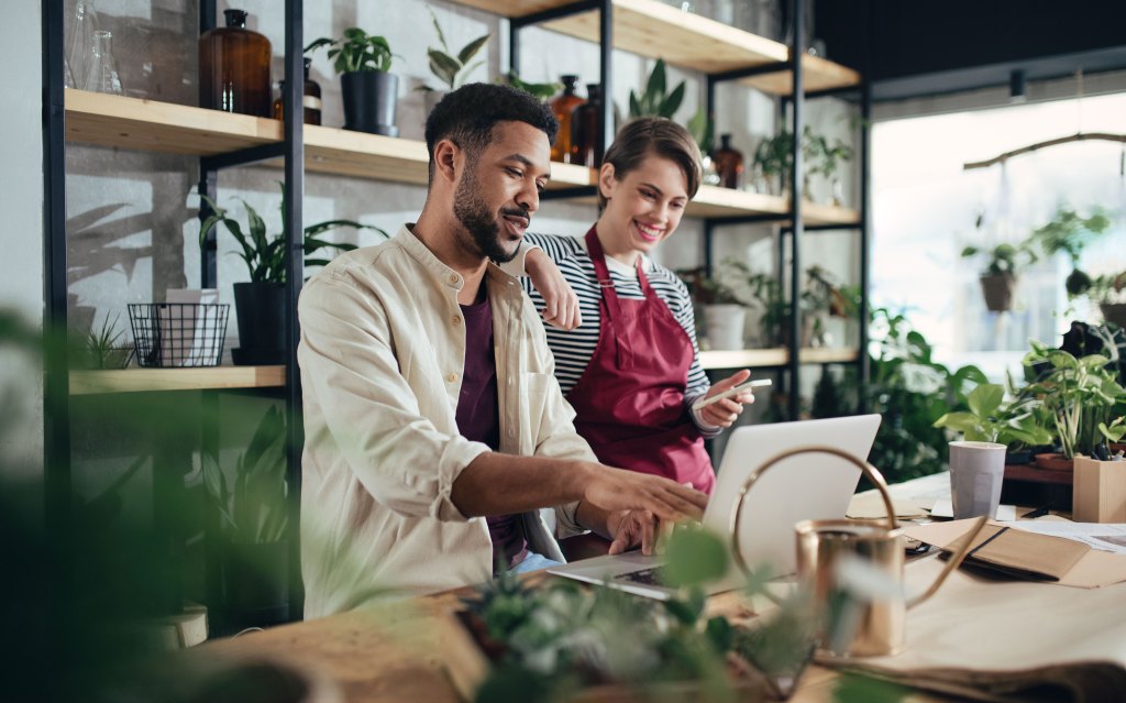 Two people working in a plant shop