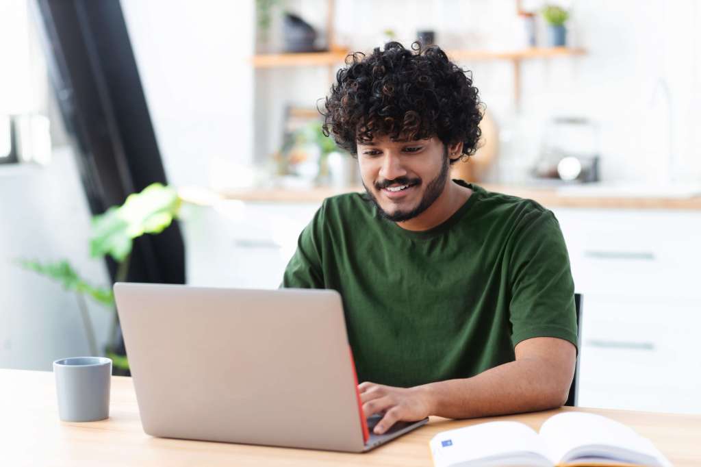 Man working on laptop at home