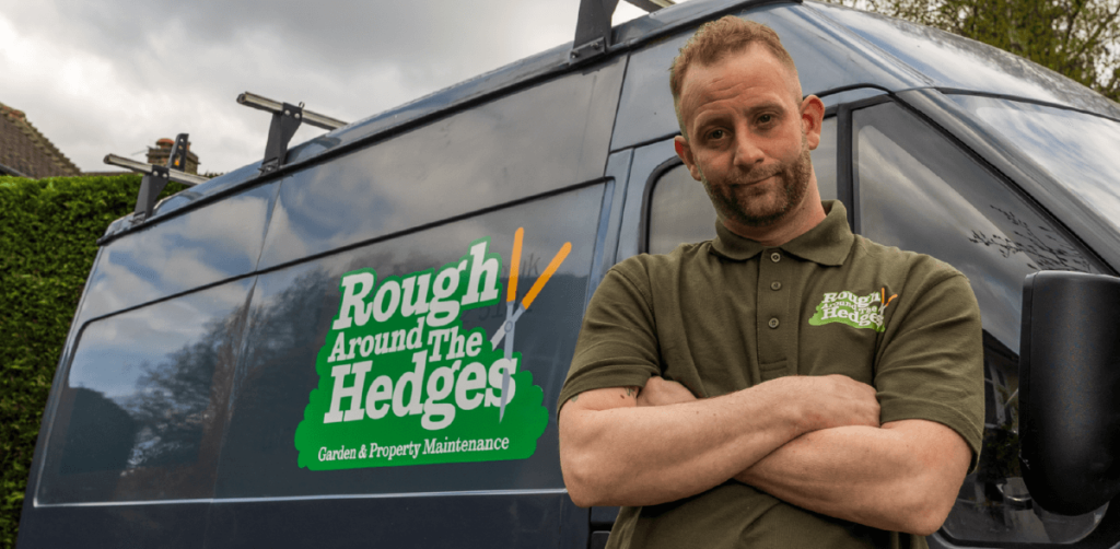 Garden maintenance business owner with his business van