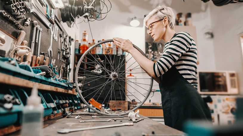 Bike wheel being fixed in a cycle shop