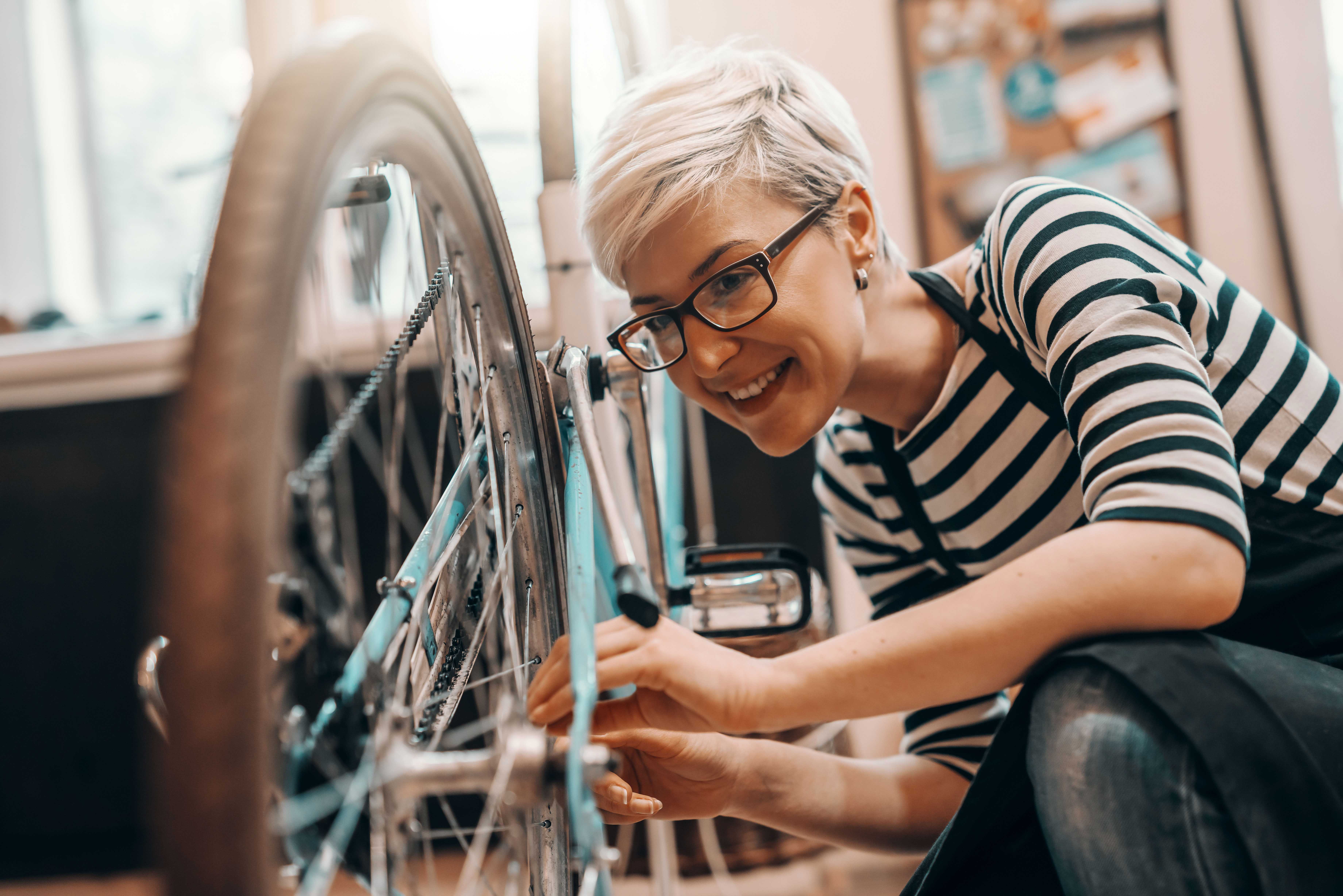 Apprentice working in bicycle repair shop