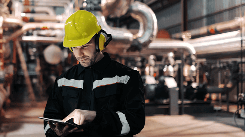 Workman wearing PPE in a factory