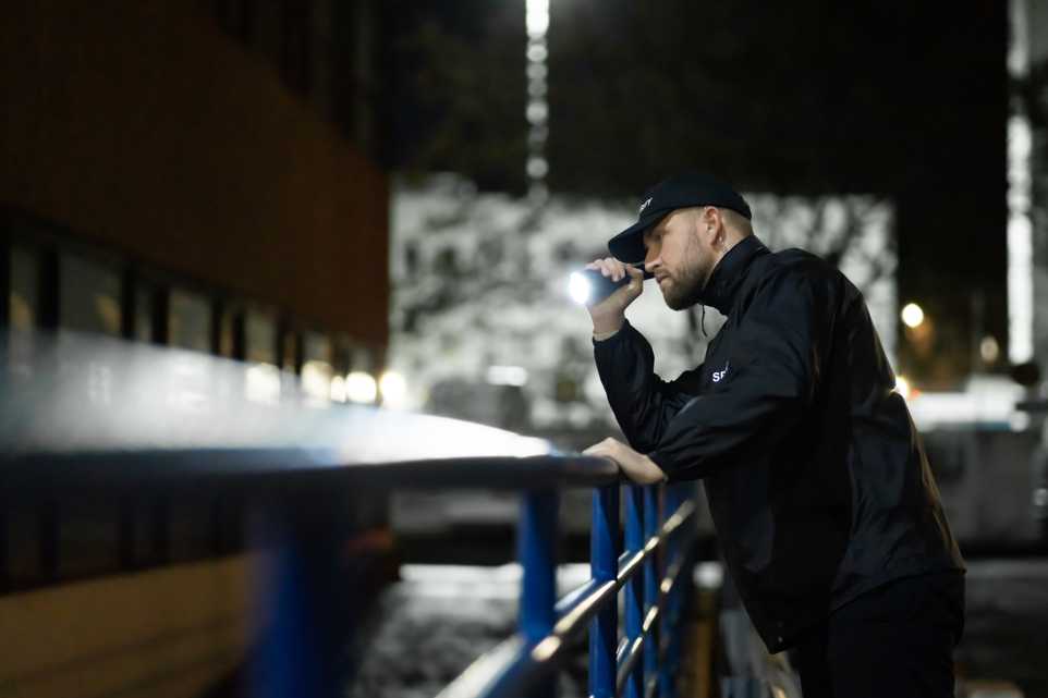 Security guard monitoring an outdoor premises