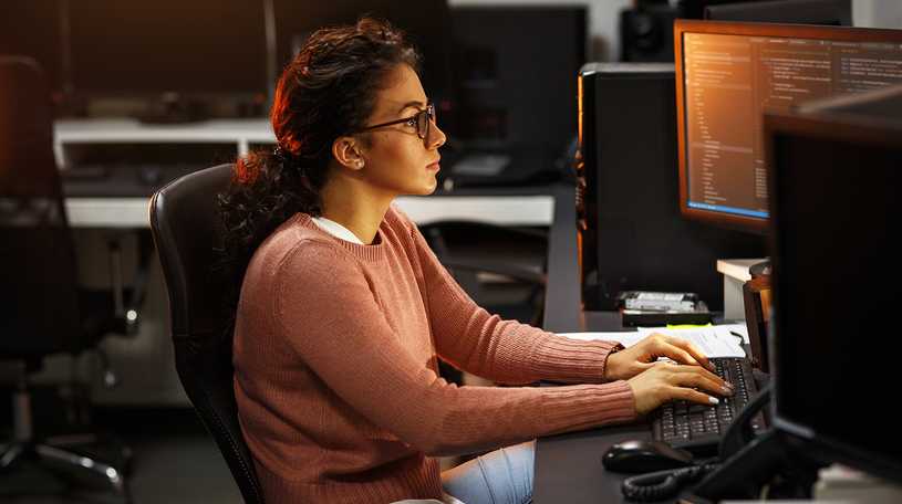 Female software developer at computer
