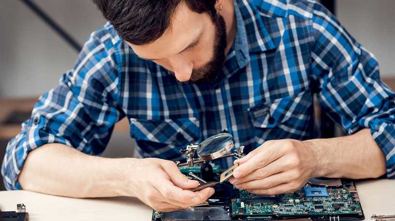 Man repairing a processor