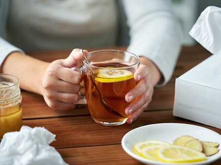 Glass mug of lemon tea