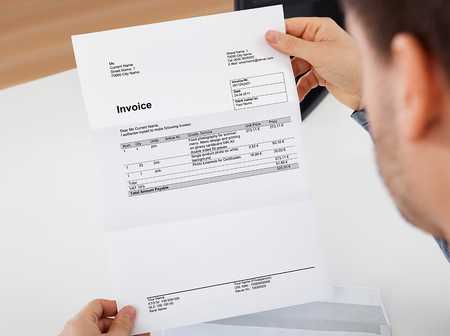 Person reading invoice for photography work