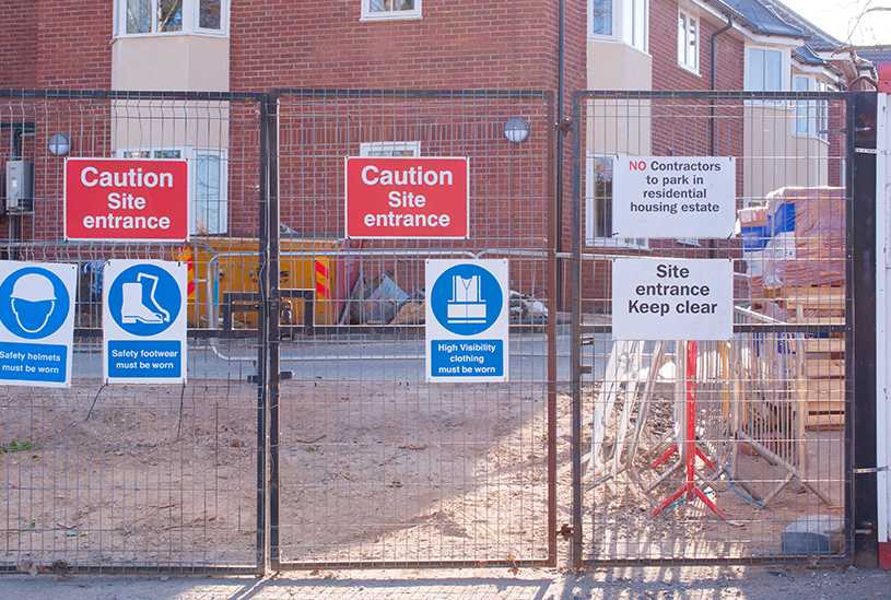 Health and safety signs at entrance to UK building site