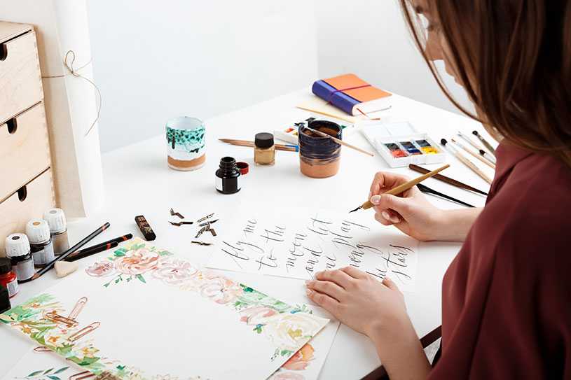 Woman doing calligraphy as a side hustle