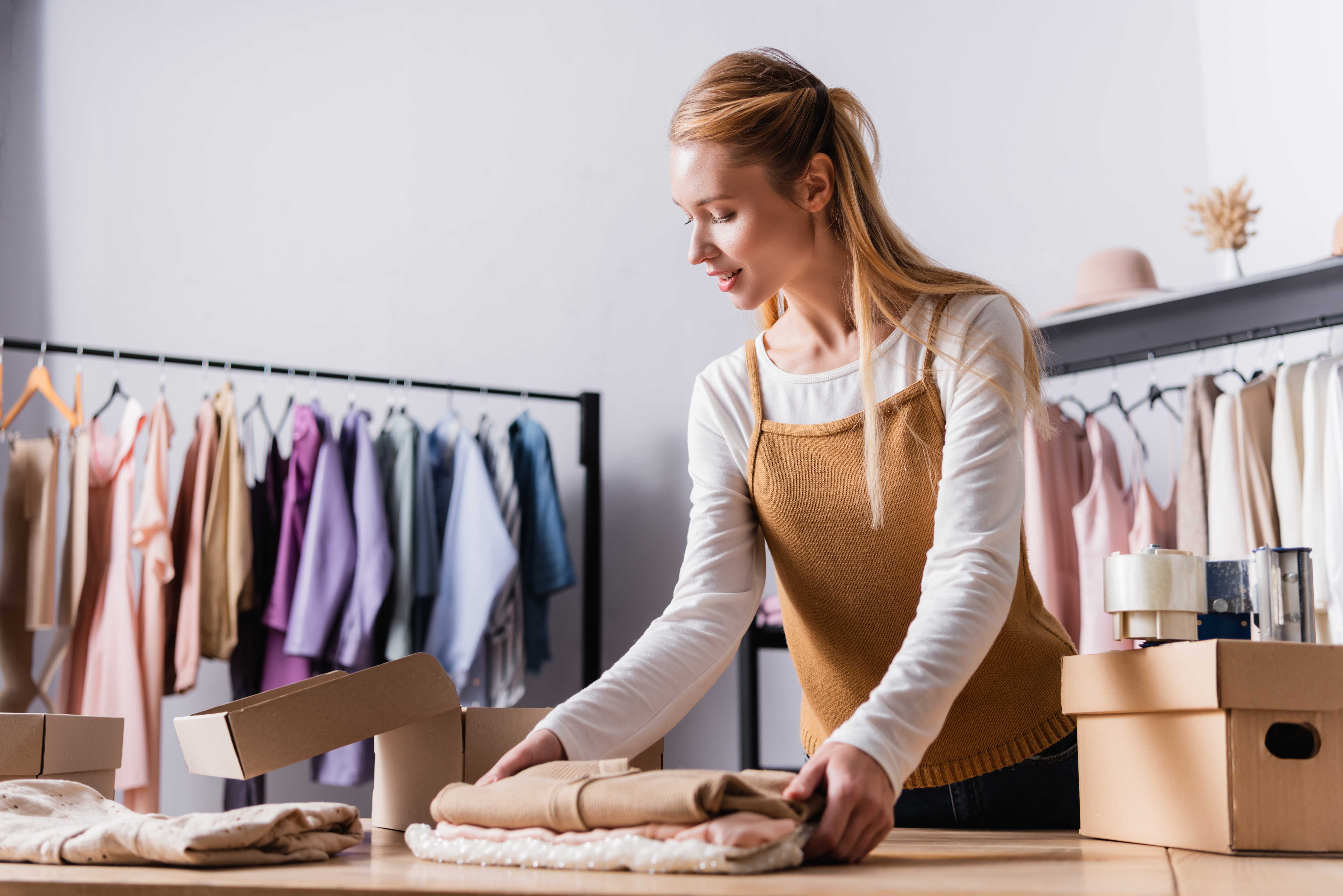 Business woman organising clothing orders