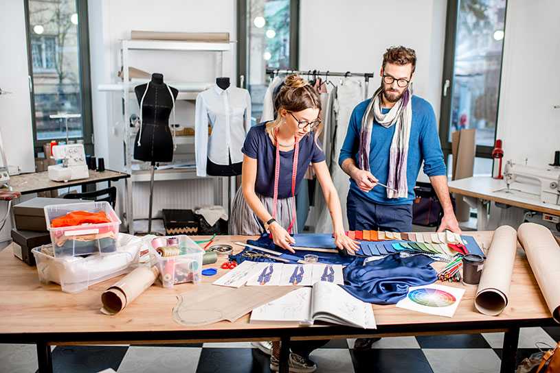 Two fashion designers in the studio