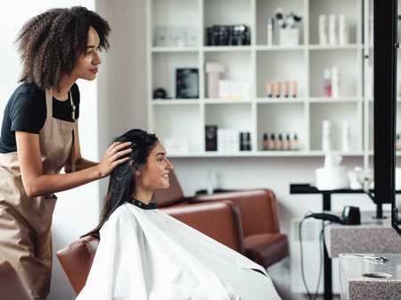 Salon stylist giving a customer a consultation