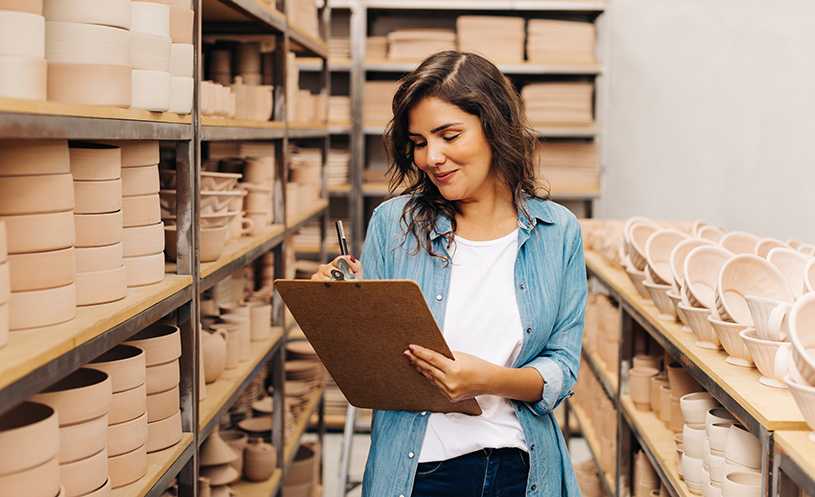 Woman checking inventory for small business