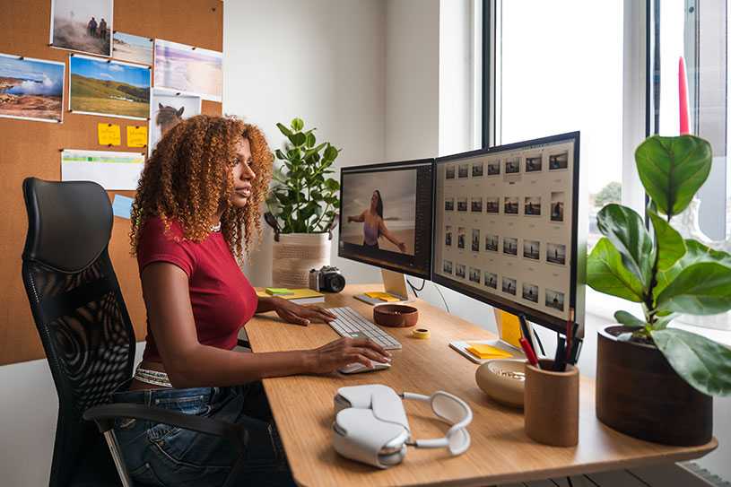 Women at a desk editing images