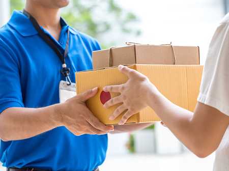 Courier handing over a package on doorstep