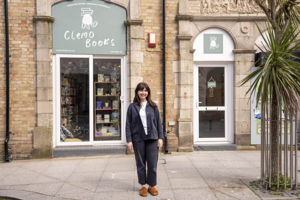 Jaimie founder of Clemo Books standing outside her shop