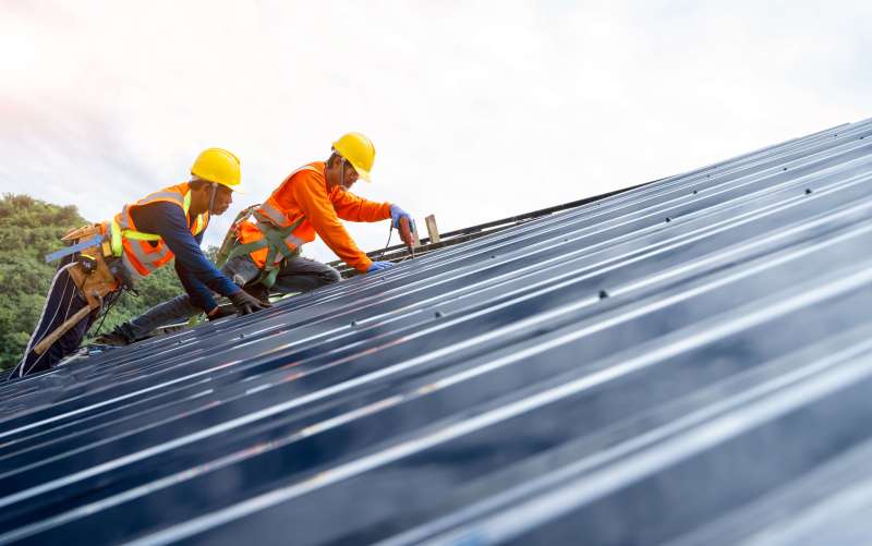 Tradespeople working on a roof