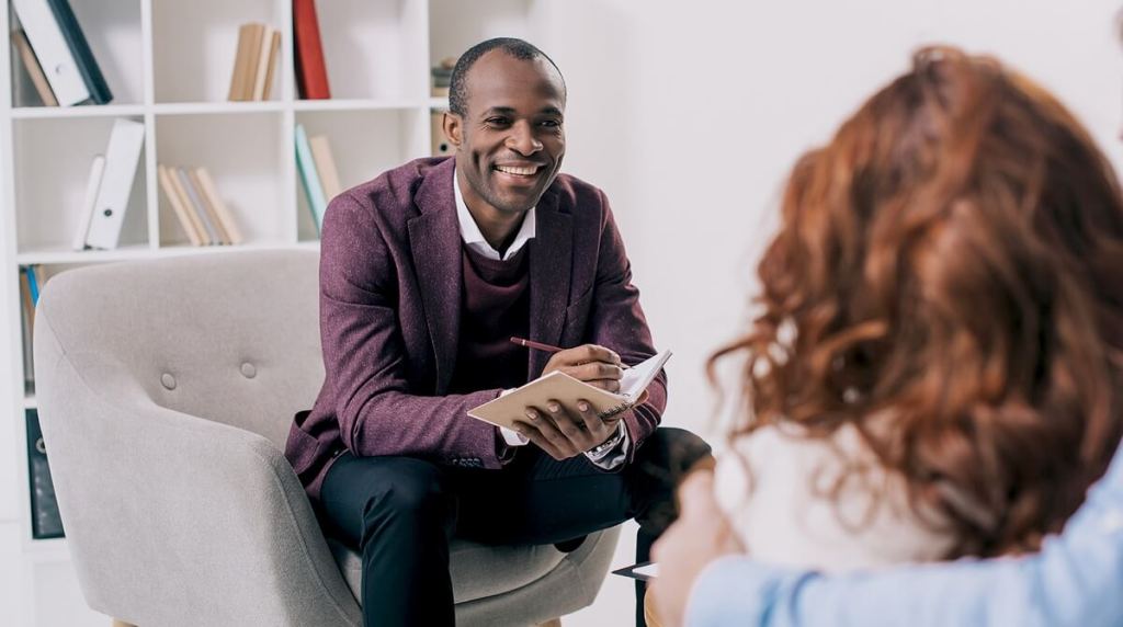 Counseller looking at patient during session