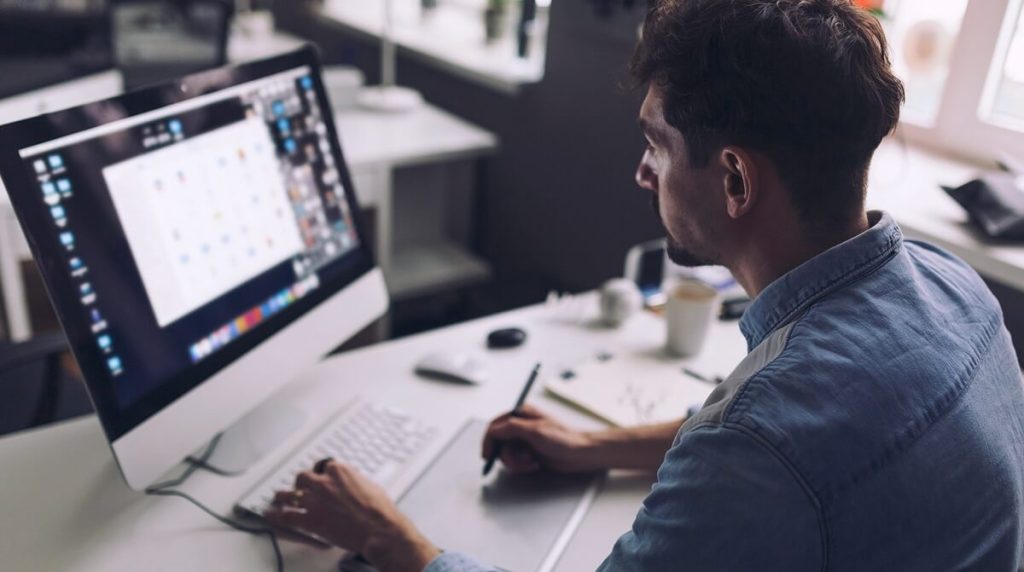 Designer working on desktop computer