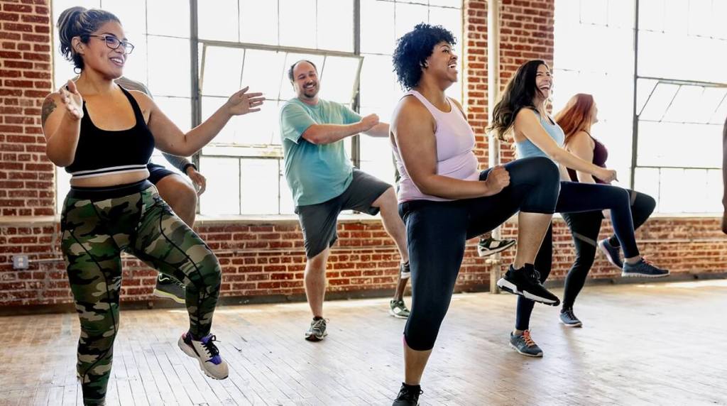 People laughing and having fun at a dance class