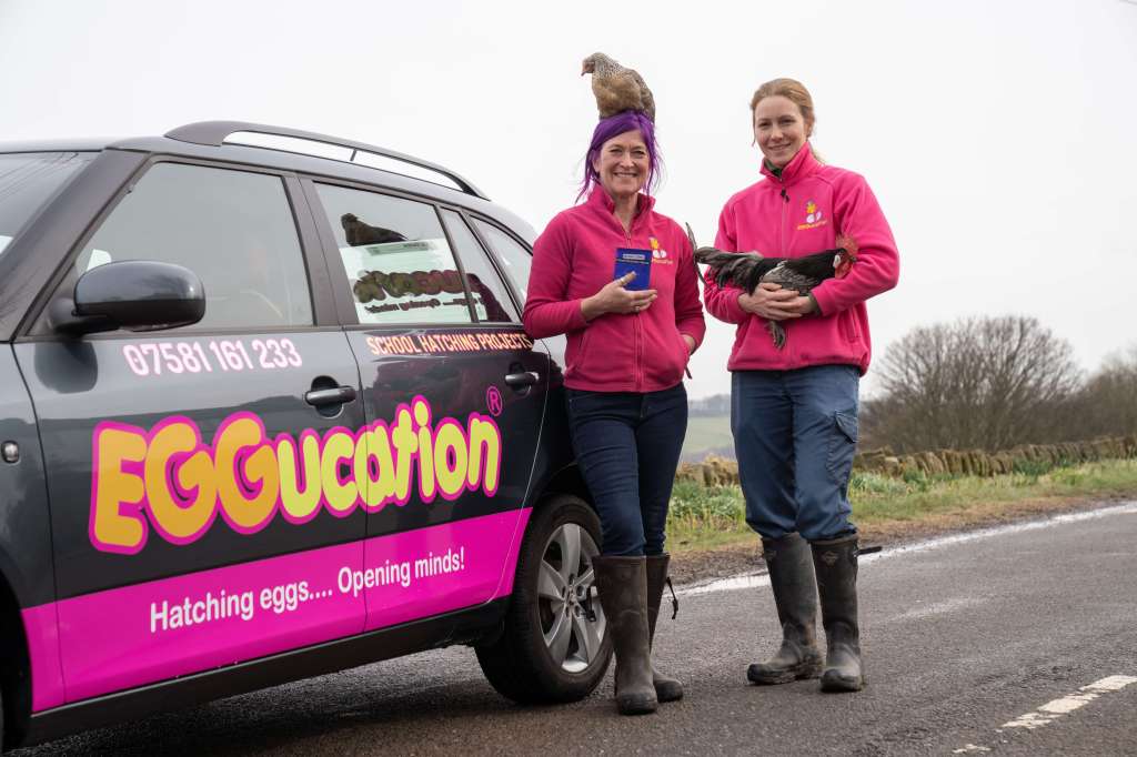 Eggucation founders with car and poultry