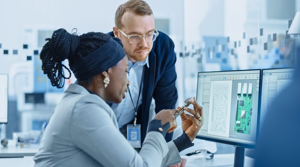 Engineers looking at product