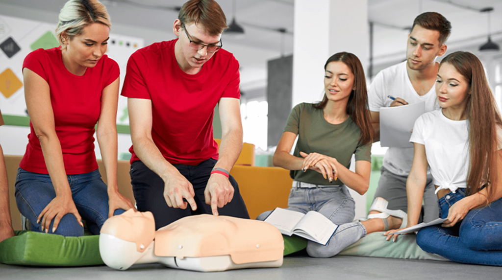 First aider demonstrating how to give CPR