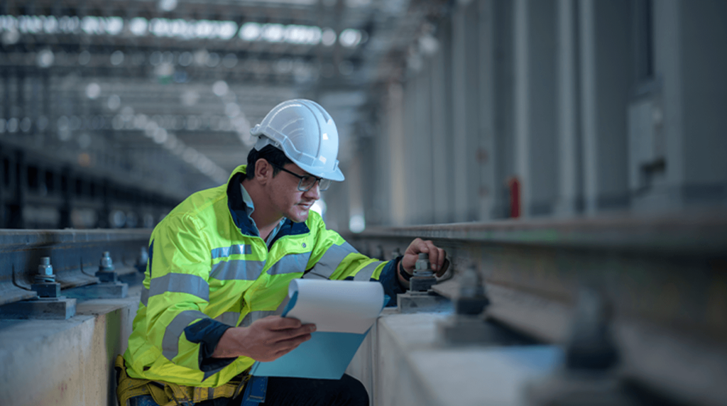 Health and safety manager checking points on a railway track