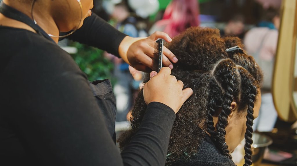 Mobile hairdressser cutting a clients hair