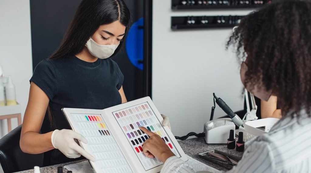 Customer picking out a nail colour in a nail salon