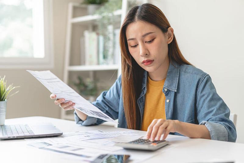 Small business owner working out finance