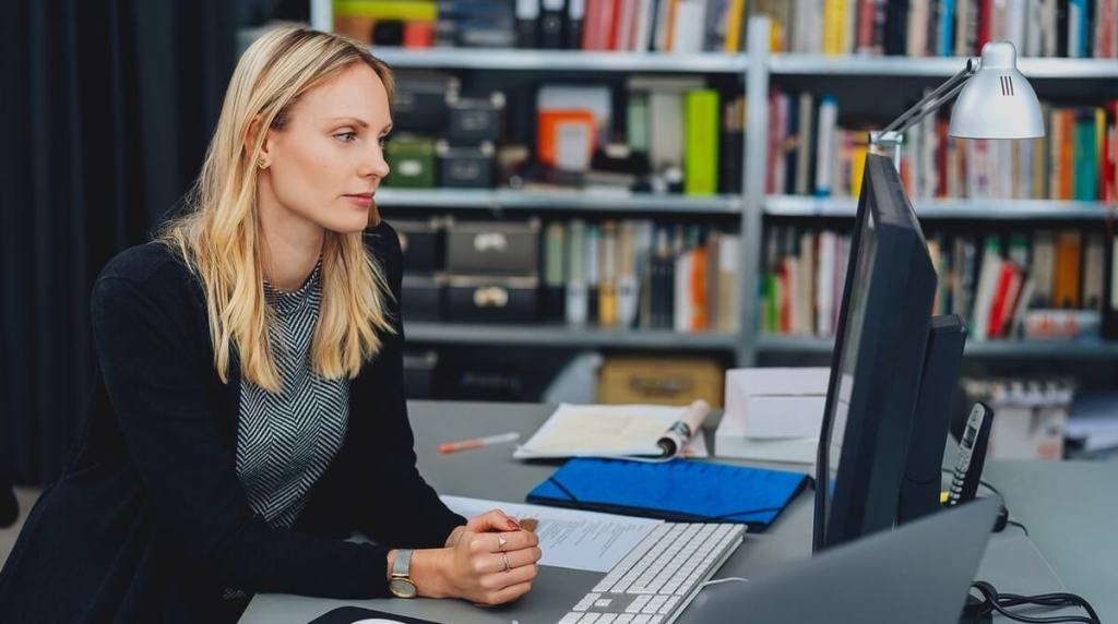 Female publisher looking at her work computer