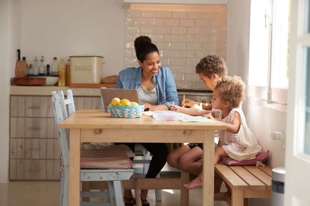 Family sat at a kitchen table