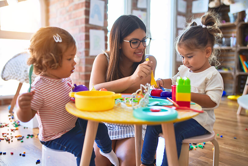 Teacher with toddlers in nursary