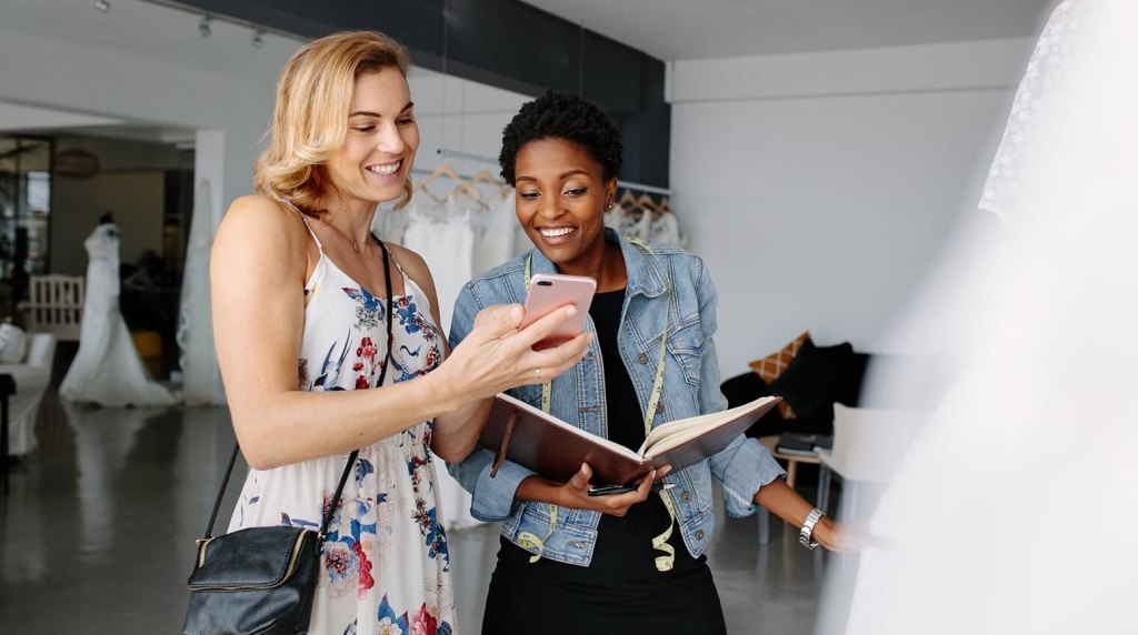 Wedding planner discussing wedding options with bride to be