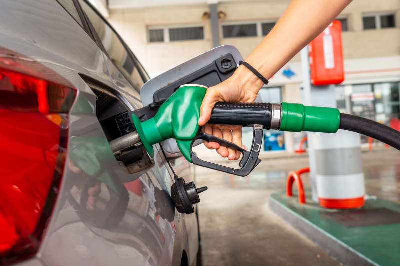 woman refuelling at a petrol station