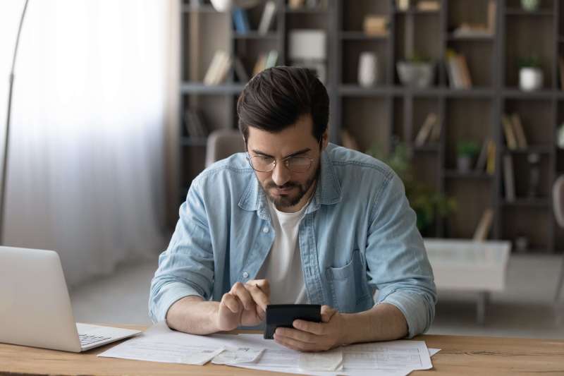 Man looking at an invoice on his phone