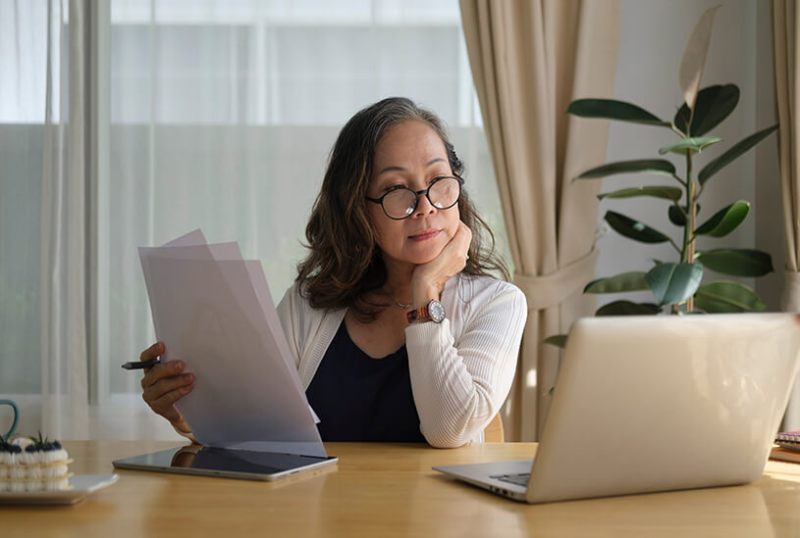Landlord sat at a desk, looking at tenancy documents