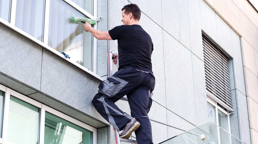 Man cleaning a window