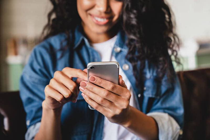 Woman managing her social media accounts for her small business