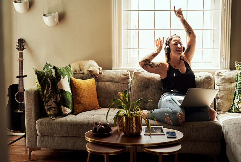 Tenant listening to music at home with headphones