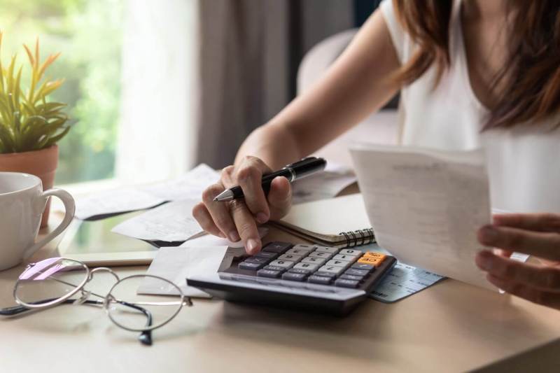 Woman looking at her bank statements