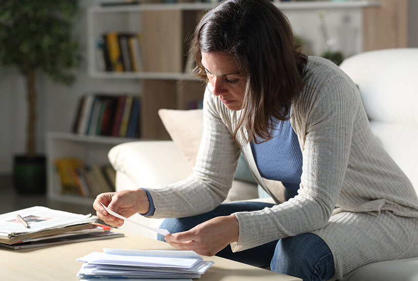Self-employed person looking at bills