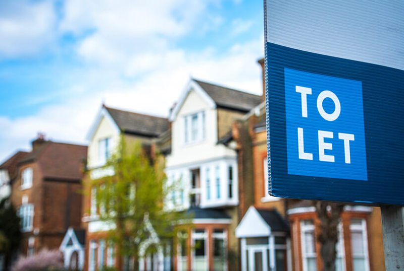 To let sign outside row of houses