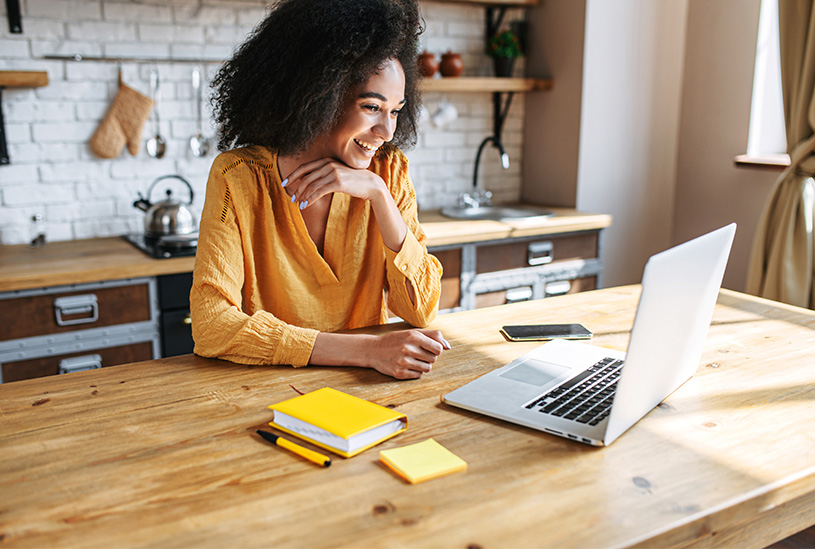 Business owner building a website on her laptop