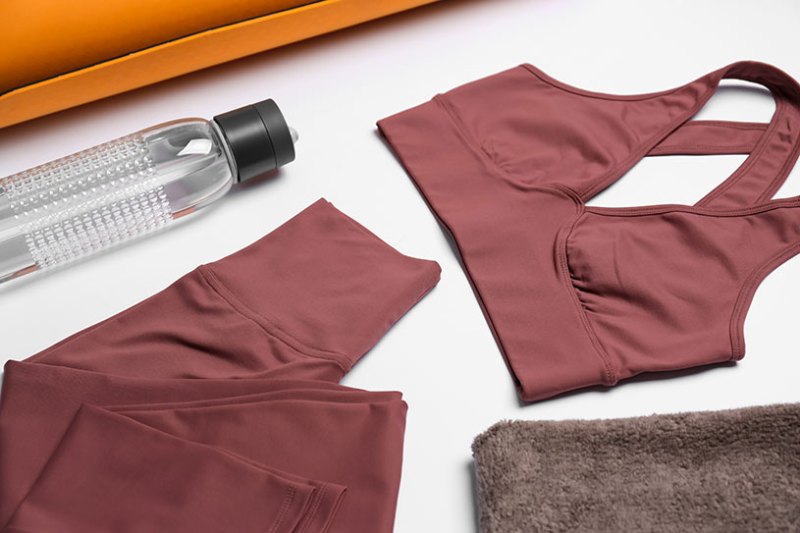 Activewear flat lay with a water bottle