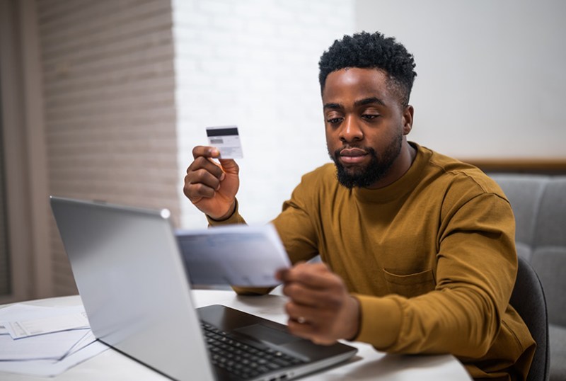 Landlord paying tax by card on their laptop