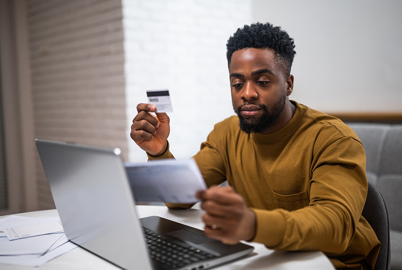 Landlord paying tax by card on their laptop